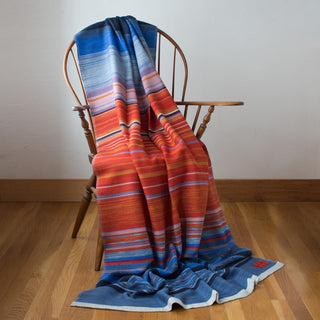 colorful throw blanket draped on chair
