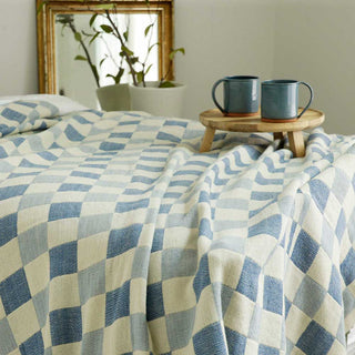 checked wool blanket on bed